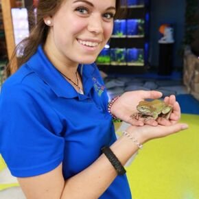 Employee with Tree Frog at Friendly Pets